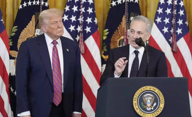 White House AI and crypto czar David Sacks speaks as President Donald Trump listens at an event for the signing of the GENIUS Act, a bill that regulates stablecoins, a type of cryptocurrency, in the East Room of the White House, Friday, July 18, 2025, in Washington. (AP Photo/Alex Brandon)