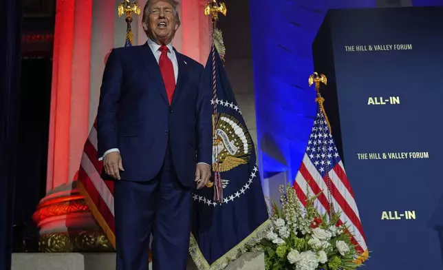 President Donald Trump arrives at an AI summit at the Andrew W. Mellon Auditorium, Wednesday, July 23, 2025, in Washington. (AP Photo/Julia Demaree Nikhinson)
