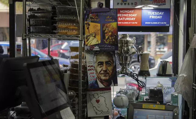 Persian-language magazines are displayed near the register of a grocery store in the "Tehrangeles" neighborhood of Los Angeles Tuesday, June 24, 2025. (AP Photo/Jae C. Hong)