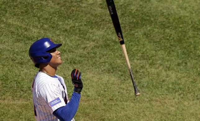 New York Mets' Juan Soto reacts after being called out on strikes during the fifth inning of a baseball game against the New York Yankees, Sunday, July 6, 2025, in New York. (AP Photo/Adam Hunger)