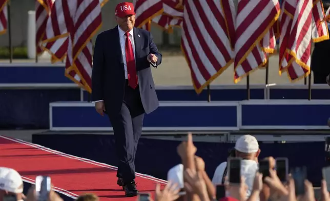 President Donald Trump arrives to speak at a rally at the Iowa State Fairgrounds, Thursday, July 3, 2025, in Des Moines, Iowa. (AP Photo/Charlie Neibergall)