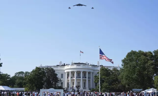 A B-2 bomber and two F-22 fighters conduct a flyover during a Fourth of July celebration at the White House, Friday, July 4, 2025, in Washington. (AP Photo/Evan Vucci)