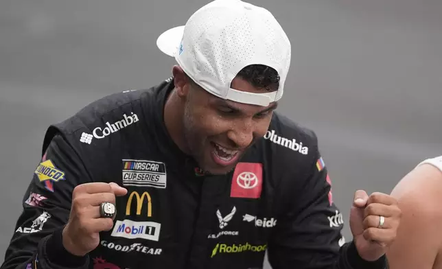 Bubba Wallace reacts after winning a NASCAR Cup Series auto race at Indianapolis Motor Speedway, Sunday, July 27, 2025, in Indianapolis. (AP Photo/Darron Cummings)