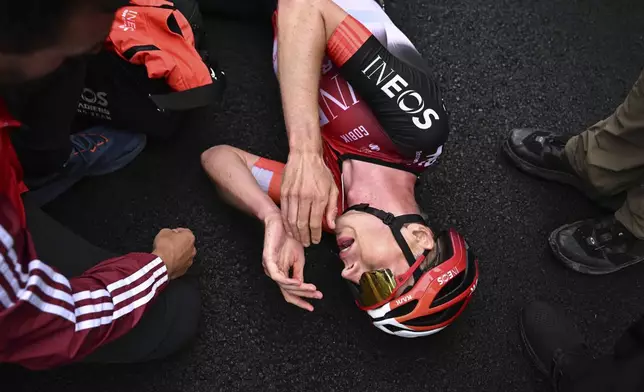 Stage winner Netherlands' Thymen Arensman reacts after the fourteenth stage of the Tour de France cycling race over 182.6 kilometers (113.5 miles) with start in Pau and finish in Luchon Superbagneres, France, Saturday, July 19, 2025. (Loic Venance/Pool Photo via AP)
