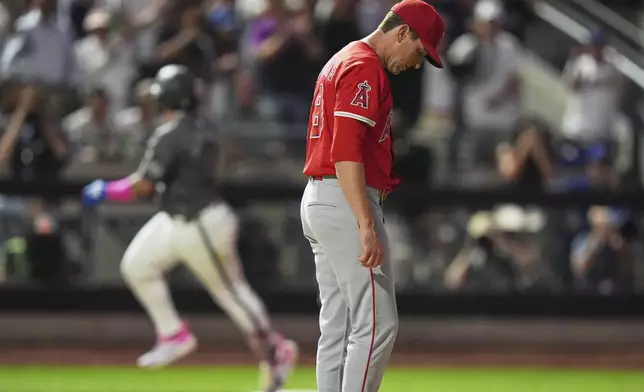 Los Angeles Angels pitcher Kyle Hendricks reacts as New York Mets' Francisco Alvarez runs the bases after hitting a two-run home run during the fifth inning of a baseball game Tuesday, July 22, 2025, in New York. (AP Photo/Frank Franklin II)