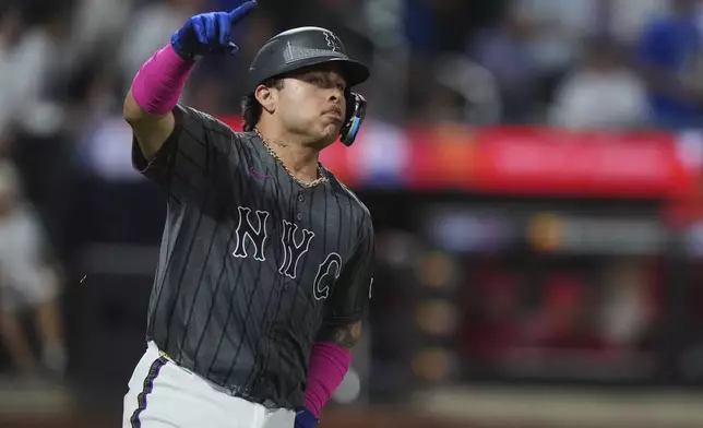 New York Mets' Francisco Alvarez gestures as he runs the bases after hitting a two-run home run during the fifth inning of a baseball game against the Los Angeles Angels Tuesday, July 22, 2025, in New York. (AP Photo/Frank Franklin II)