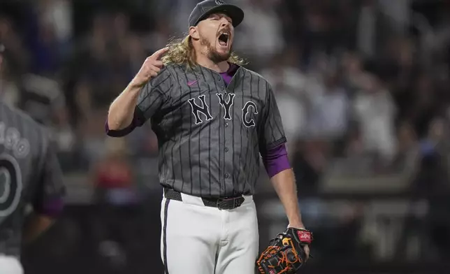 New York Mets pitcher Ryne Stanek celebrates after a baseball game against the Los Angeles Angels Tuesday, July 22, 2025, in New York. (AP Photo/Frank Franklin II)