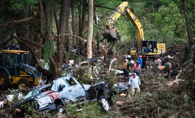 First responders carry out search and rescue operations near the Guadalupe River after a flash flood swept through the area, Monday, July 7, 2025, in Ingram, Texas. (AP Photo/Eli Hartman)
