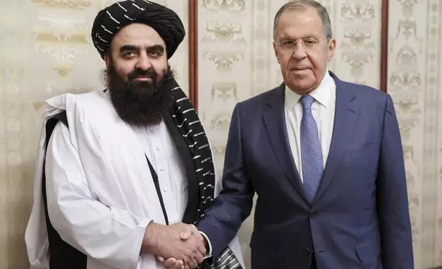 FILE - In this photo released by Russian Foreign Ministry Press Service on Oct. 4, 2024, Russian Foreign Minister Sergey Lavrov, right, and Acting Foreign Minister of Afghanistan's Taliban movement Amir Khan Muttaqi pose for a photo prior to their talks in Moscow, Russia. (Russian Foreign Ministry Press Service via AP, File)