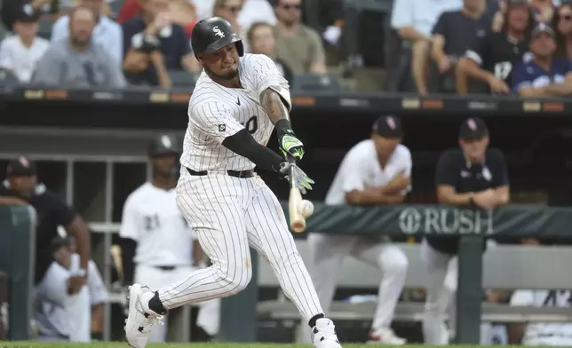 Chicago White Sox second baseman Lenyn Sosa (50) singles during the fifth inning of a baseball game between the Chicago Cubs and Chicago White Sox, Saturday, July 26, 2025, in Chicago. (AP Photo/Talia Sprague)
