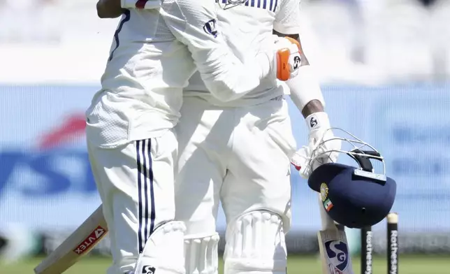 India's Ravindra Jadeja, left, congratulates India's KL Rahul after scoring a century during the third cricket test match between England and India at Lord's cricket ground in London, Saturday, July 12, 2025. (AP Photo/Richard Pelham)
