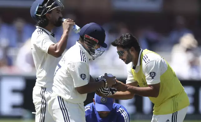 India's Rishabh Pant gets ice bag on his hand after a ball hits during the third cricket test match between England and India at Lord's cricket ground in London, Saturday, July 12, 2025. (AP Photo/Richard Pelham)