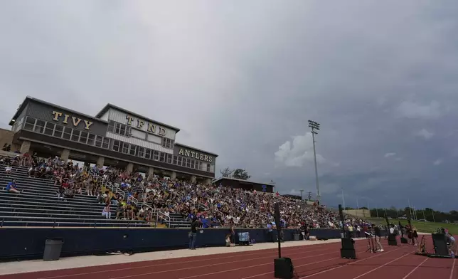 Clouds move in during a vigil for flooding victims at Tivy Antler Stadium on Wednesday, July 9, 2025, in Kerrville, Texas. (AP Photo/Ashley Landis)