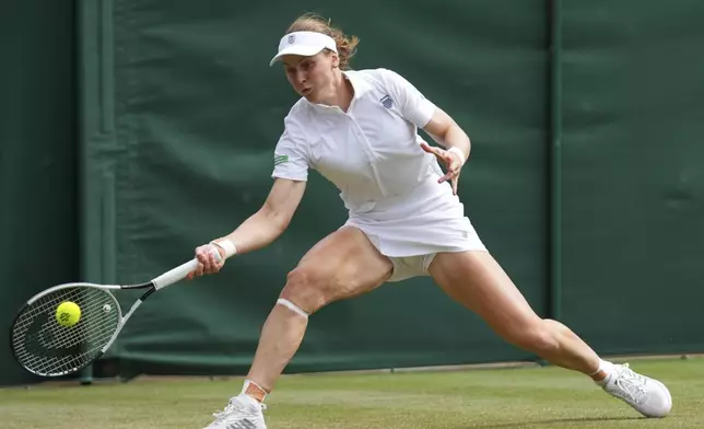 Liudmilla Samsonova of Russia plays a return to Jessica Bouzas Maneiro of Spain during their women's singles fourth round match at the Wimbledon Tennis Championships in London, Monday, July 7, 2025.(AP Photo/Joanna Chan)