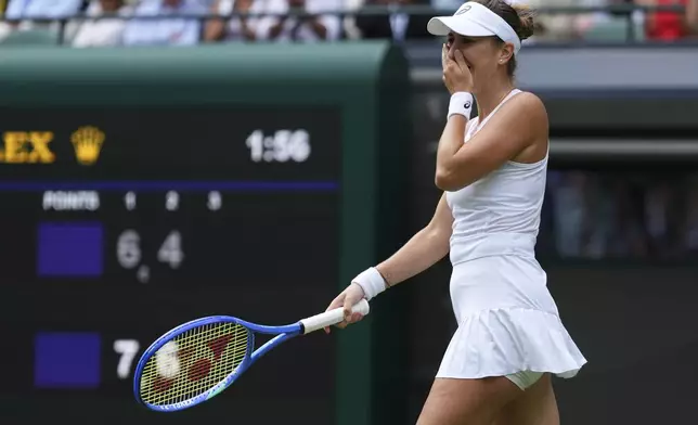 Belinda Bencic of Switzerland reacts after winning her women's singles fourth round match against Ekaterina Alexandrova of Russia at the Wimbledon Tennis Championships in London, Monday, July 7, 2025.(AP Photo/Kirsty Wigglesworth)