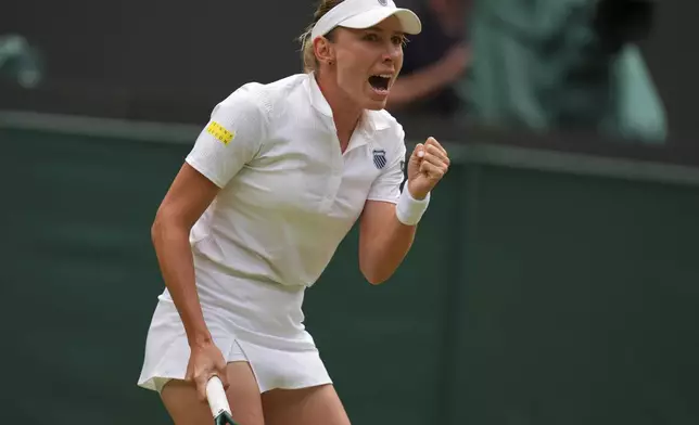 Ekaterina Alexandrova of Russia celebrates a point during her women's singles fourth round match against Belinda Bencic of Switzerland at the Wimbledon Tennis Championships in London, Monday, July 7, 2025.(AP Photo/Kirsty Wigglesworth)