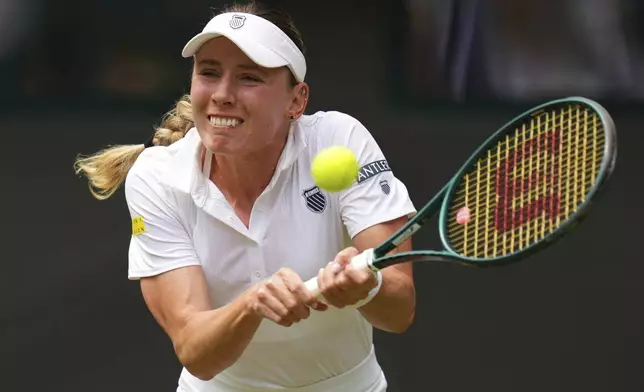 Ekaterina Alexandrova of Russia plays a return to Belinda Bencic of Switzerland during their women's singles fourth round match at the Wimbledon Tennis Championships in London, Monday, July 7, 2025.(AP Photo/Kirsty Wigglesworth)