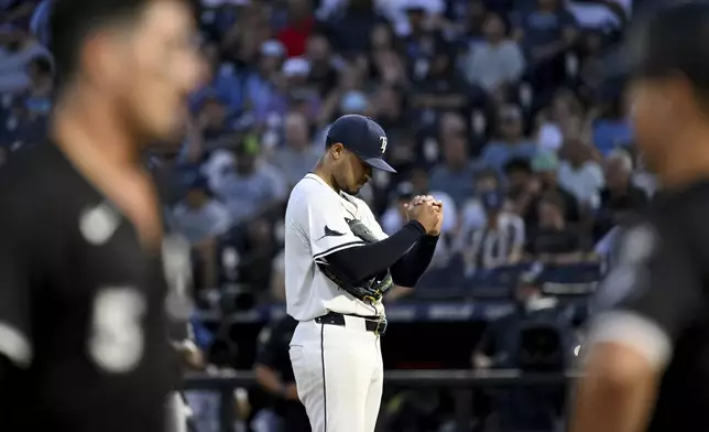 Tampa Bay Rays pitcher Taj Bradley reacts after Chicago White Sox's Colson Montgomery's three-run home run during the second inning of a baseball game against the Tampa Bay Rays Wednesday, July 23, 2025, in Tampa, Fla. (AP Photo/Jason Behnken)