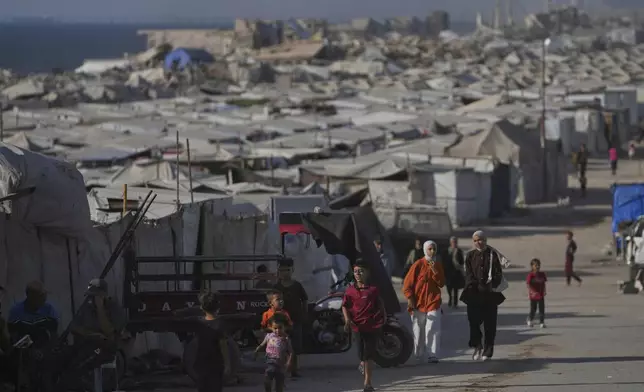 A camp of tents housing displaced Palestinians extends across Gaza City, Thursday, July 17, 2025. (AP Photo/Jehad Alshrafi)