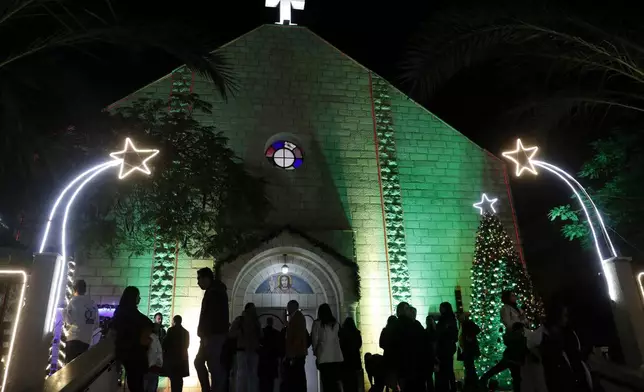 FILE - Palestinian Christians wait to pray at the midnight Christmas Eve mass out side the Deir Al Latin Holy Family Catholic Church in Gaza City, Dec. 24, 2021. (AP Photo/Adel Hana, file)