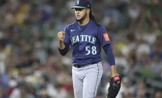 Seattle Mariners pitcher Luis Castillo pumps his fist after the final out of the sixth inning of a baseball game against the Athletics, Monday, July 28, 2025, in West Sacramento, Calif. (AP Photo/Scott Marshall)
