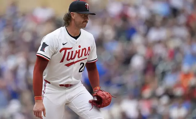 Minnesota Twins starting pitcher Chris Paddack stands on the mound as Chicago Cubs' Pete Crow-Armstrong runs the bases after hitting a 2-run home run during the third inning of a baseball game Thursday, July 10, 2025, in Minneapolis. (AP Photo/Abbie Parr)