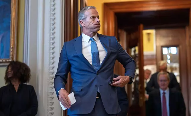 Senate Majority Leader John Thune, R-S.D., emerges from the chamber just after passage of the budget reconciliation package of President Donald Trump's signature bill of big tax breaks and spending cuts, at the Capitol in Washington, Tuesday, July 1, 2025. (AP Photo/J. Scott Applewhite)