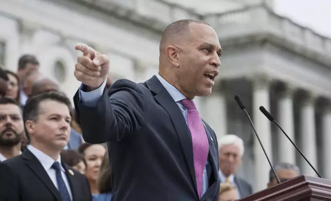 House Minority Leader Hakeem Jeffries, D-N.Y., and the Democratic Caucus, assemble on the steps of the Capitol to condemn President Donald Trump's signature bill of tax breaks and spending cuts, in Washington, Wednesday, July 2, 2025. (AP Photo/J. Scott Applewhite)