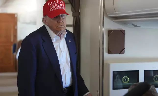 President Donald Trump talks with reporters on Air Force One after visiting a migrant detention center in Ochopee, Fla., Tuesday, July 1, 2025, as he heads back to Joint Base Andrew, Md. (AP Photo/Evan Vucci)
