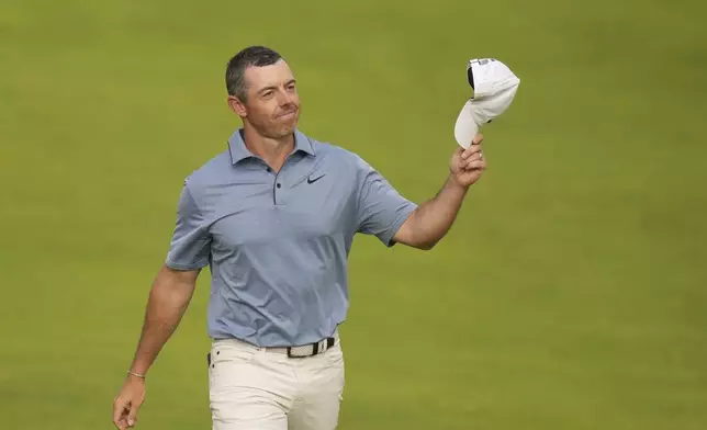 Rory McIlroy of Northern Ireland acknowledges the crowd as he walks onto the 18th green during the final round of the British Open golf championship at the Royal Portrush Golf Club, Northern Ireland, Sunday, July 20, 2025. (AP Photo/Francisco Seco)