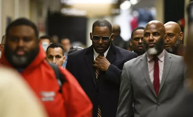 FILE - Musician R. Kelly arrives at the Daley Center for a hearing in his child support case on May 8, 2019, in Chicago. (AP Photo/Matt Marton, File)