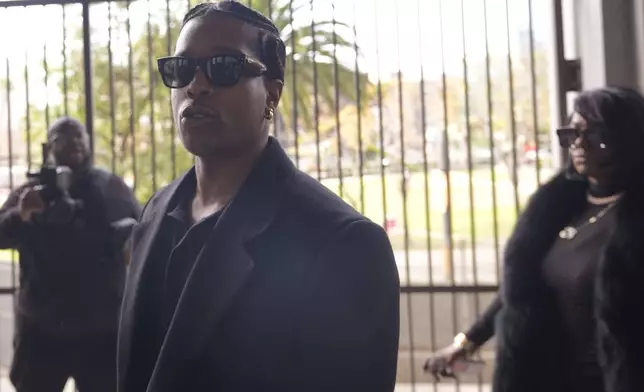 FILE - Grammy-nominated rapper A$AP Rocky, center, facing two felony counts of assault with a semiautomatic firearm after allegedly shooting at a former friend in 2021, arrives at the Clara Shortridge Foltz Criminal Justice Center in Los Angeles, Jan. 22, 2025. (AP Photo/Damian Dovarganes, File)