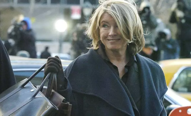 FILE - Martha Stewart arrives at a Manhattan federal courthouse, Jan. 20, 2004, for her first appearance at her closely watched trial. Stewart was convicted in 2004 of lying to the federal government about a 2001 stock sale. She served five months in prison. (AP Photo/Ed Betz, File)