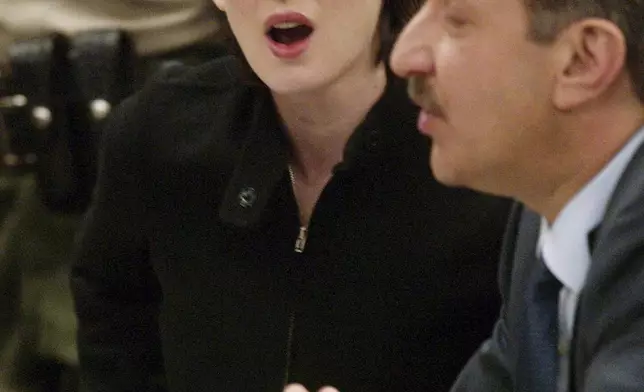 FILE - Actress Winona Ryder reacts in court during her sentencing hearing for her shoplifting case in Beverly Hills, Calif., Dec. 6, 2002. At right is Ryder's lawyer Mark Geragos. (Steve Grayson/Pool Photo via AP, File)