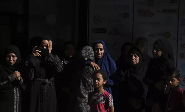 Mourners gather at Al-Awda Hospital in Nuseirat on Tuesday, July 8, 2025, to attend the funeral of victims killed in an Israeli airstrike on the Gaza Strip. (AP Photo/Abdel Kareem Hana)