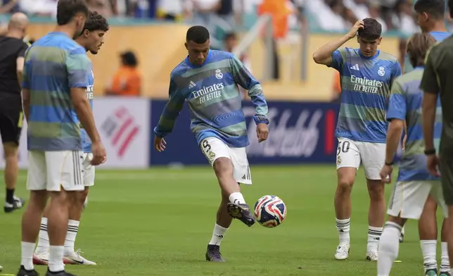 Real Madrid's Kylian Mbappe warms up for the Club World Cup round of 16 soccer match between Real Madrid and Juventus in Miami Gardens, Fla., Tuesday, July 1, 2025. (AP Photo/Rebecca Blackwell)