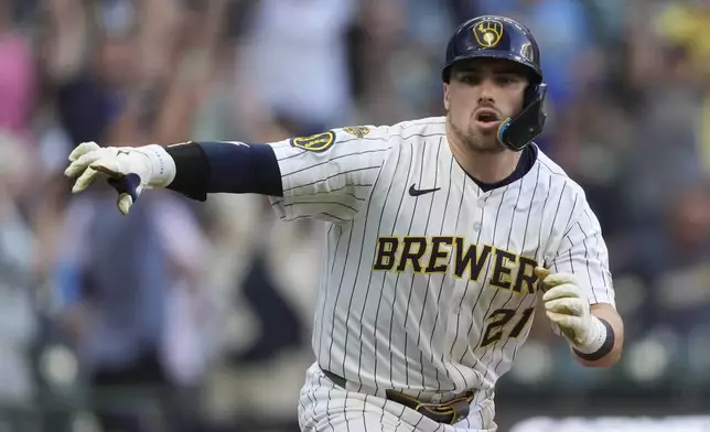 Milwaukee Brewers' Caleb Durbin gestures after hitting a walkoff single during the ninth inning of a baseball game against the Washington Nationals, Saturday, July 12, 2025, in Milwaukee. (AP Photo/Aaron Gash)