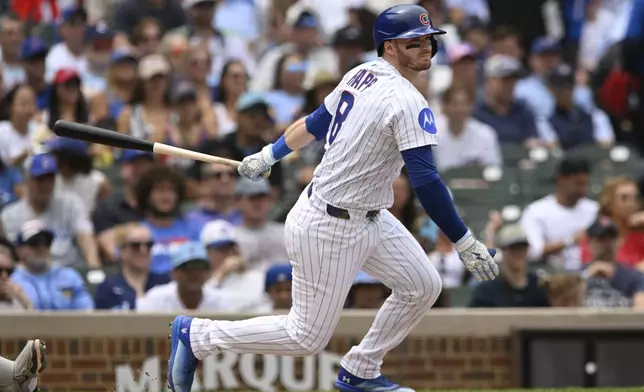 Chicago Cubs' Ian Happ watches his RBI single during the second inning of a baseball game against the Boston Red Sox, Sunday, July 20, 2025, in Chicago. (AP Photo/Paul Beaty)