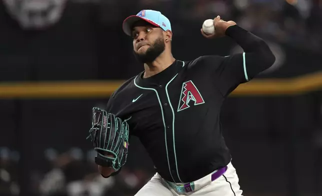 Arizona Diamondbacks pitcher Eduardo Rodriguez throws against the Kansas City Royals in the first inning during a baseball game, Friday, July 4, 2025, in Phoenix. (AP Photo/Rick Scuteri)