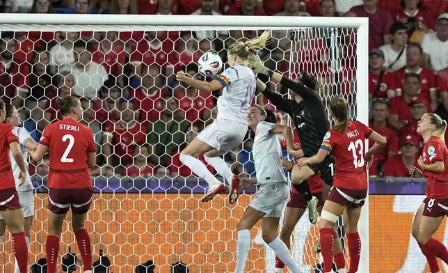 Norway's Ada Hegerberg, center, scores her side's first goal during the Euro 2025, group A, soccer match between Switzerland and Norway at St. Jakob-Park in Basel, Switzerland, Wednesday, July 2, 2025. (AP Photo/Martin Meissner)