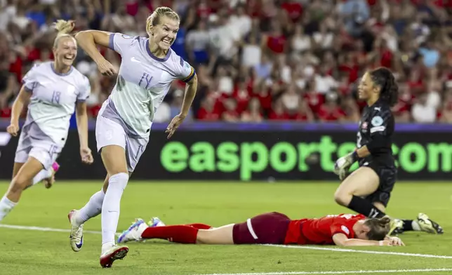 Norway's Frida Maanum, left and Ada Hegerberg (14) celebrate an own goal by Switzerland's defender Julia Stierli, on pitch during the Euro 2025 Group A soccer match between Switzerland and Norway at the St. Jakob-Park stadium in Basel, Switzerland, Wednesday, July 2, 2025. (Michael Buholzer/Keystone via AP)