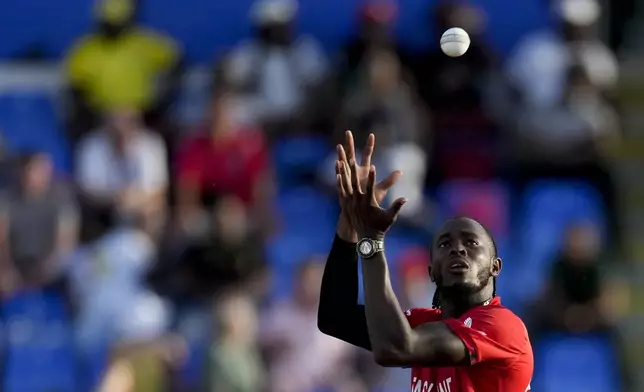 FILE - England's Jofra Archer receives the ball to bowl against Namibia during an ICC Men's T20 World Cup cricket match at Siv Vivian Richards Stadium in North Sound, Antigua and Barbuda, Saturday, June 15, 2024. (AP Photo/Ricardo Mazalan, File)