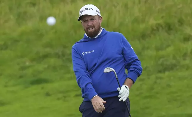 Shane Lowry of Ireland watches the flight of his ball on the 16th hole during a practice round for the British Open golf championship at the Royal Portrush Golf Club, Northern Ireland, Tuesday, July 15, 2025. (AP Photo/Francisco Seco)