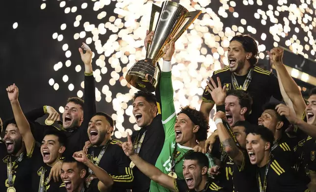 Mexico players and staff celebrate after their win in the CONCACAF Gold Cup final soccer match against the United States in Houston, Sunday, July 6, 2025. (AP Photo/Ashley Landis)