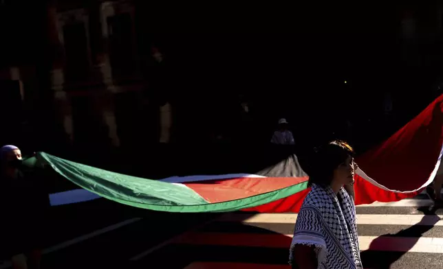 Demonstrators protest Israeli Prime Minister Benjamin Netanyahu's visit to Washington, Monday, July 7, 2025, near the White House. (AP Photo/Julia Demaree Nikhinson)