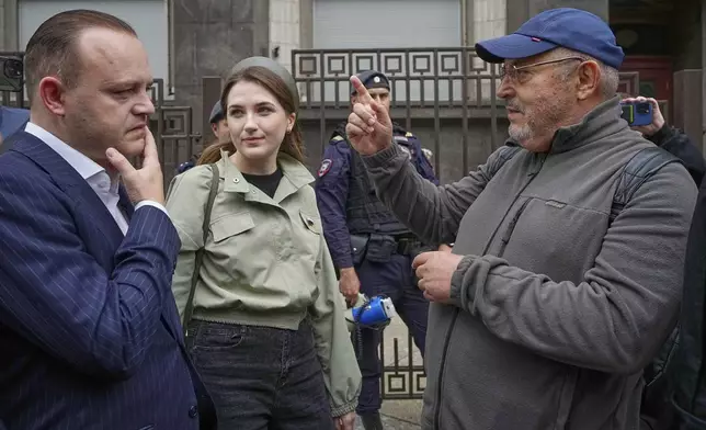 Russian politician Boris Nadezhdin, right, gestures while speaking to Vladislav Davankov, deputy chairman of the State Duma, the lower house of the Russian parliament, in Moscow, Russia, Tuesday, July 22, 2025, before lawmakers approved a bill that punishes online searches for information that is deemed “extremist.” (AP Photo/Alexander Zemlianichenko)