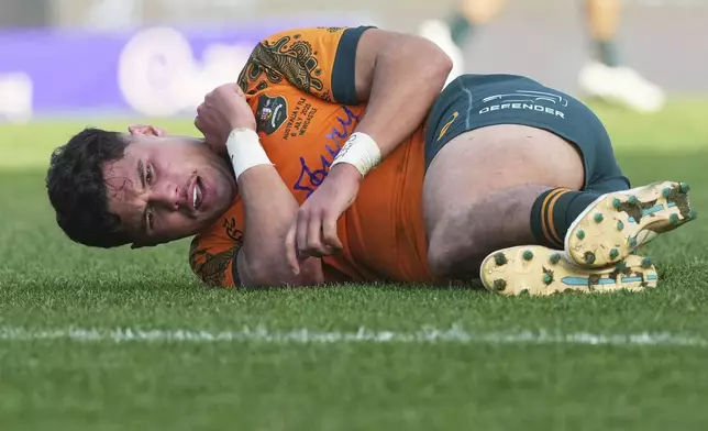 Australia's Noah Lolesio reacts after he was tackled during the rugby international between the Wallabies and Fiji in Newcastle, Australia, Sunday, July 6, 2025. (AP Photo/Mark Baker)