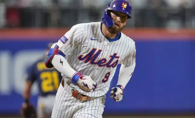 New York Mets' Brandon Nimmo runs the bases after hitting a home run during the second inning of a baseball game against the Milwaukee Brewers Thursday, July 3, 2025, in New York. (AP Photo/Frank Franklin II)