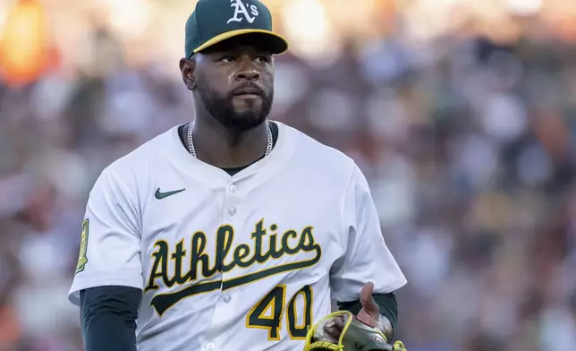Athletics pitcher Luis Severino walks to the dugout during the second inning of a baseball game against the San Francisco Giants Saturday, July 5, 2025, in West Sacramento, Calif. (AP Photo/Sara Nevis)