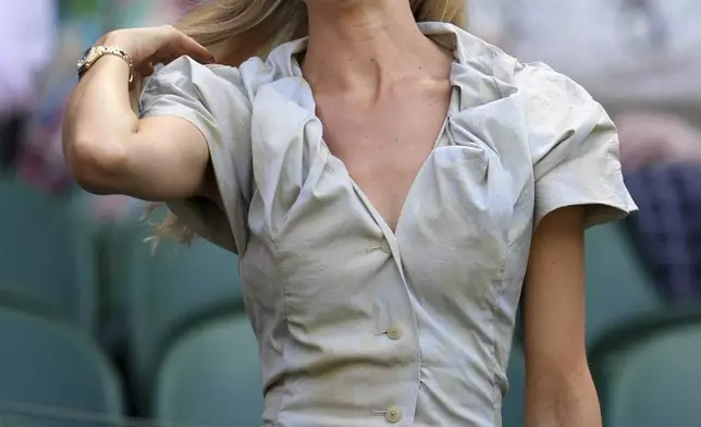 Morgan Riddle the girlfriend of Taylor Fritz of the U.S. arrives to take her seat before her boyfriend plays Spain's Carlos Alcaraz in a men's singles semifinal at the Wimbledon Tennis Championships in London, Friday, July 11, 2025. (AP Photo/Kin Cheung)